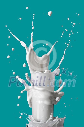 milk splash in glass isolated on blue background milk splash in glass isolated on blue background