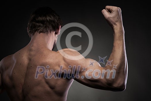 Power mens hand on black Power mens hand on black