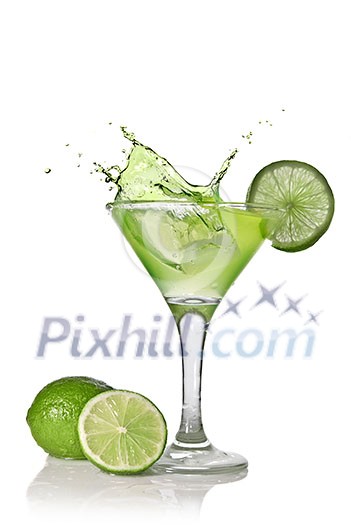 Green alcohol cocktail with splash and green lime isolated on white Green alcohol cocktail with splash and green lime isolated on white