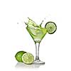 Green alcohol cocktail with splash and green lime isolated on white