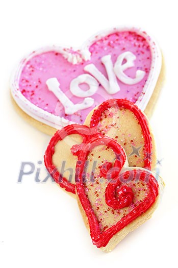 Homemade baked shortbread Valentine cookies with icing on white background