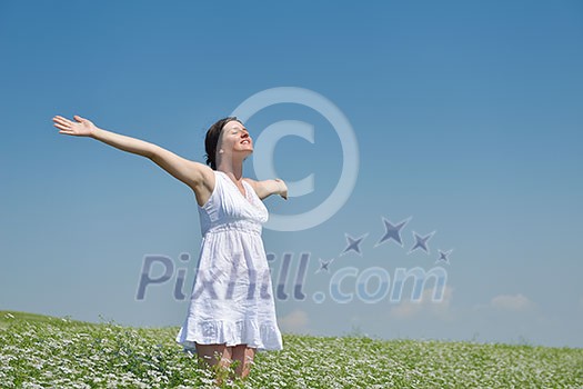 Young happy woman in green field with blue sky in background Young happy woman in green field with blue sky in background