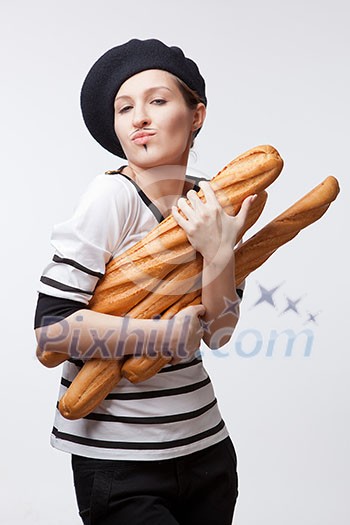 woman holding baguettes isolated on white woman holding baguettes isolated on white