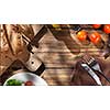 Top view of italian food on wooden table - bread, olive oil and tomatos with basil. Header for website