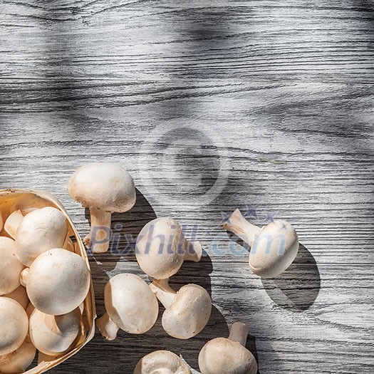 Mushrooms on wooden table, top view image Mushrooms on wooden table, top view image