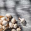Mushrooms on wooden table, top view image