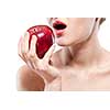 Young woman biting red apple isolated on white