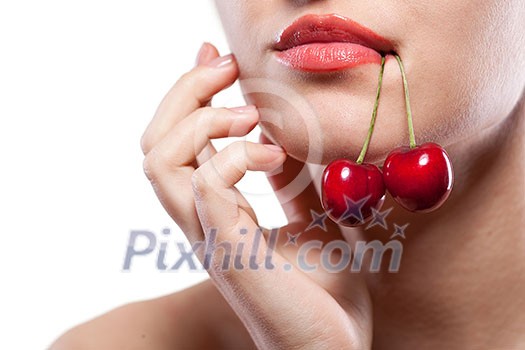 Young woman with cherry isolated on white Young woman with cherry isolated on white