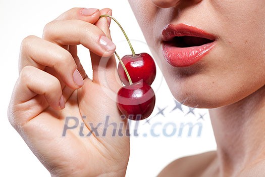 Young woman with cherry isolated on white Young woman with cherry isolated on white