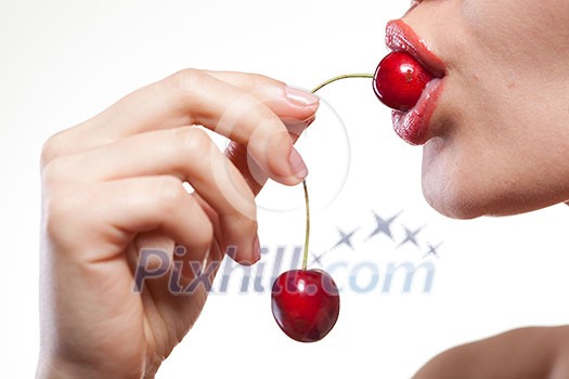 Young woman with cherry isolated on white Young woman with cherry isolated on white