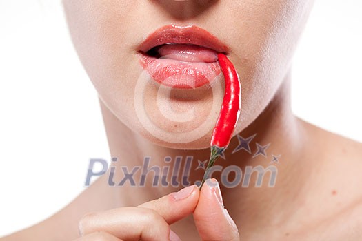 Young woman with chili pepper isolated on white