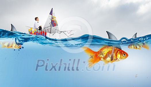 Concept of fake threat when businessman float in paper ship and sharks in water appear to be goldfish Concept of fake threat when businessman float in paper ship and sharks in water appear to be goldfish