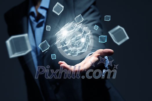 Businesswoman hand shows cube as symbol of problem solving Businesswoman hand shows cube as symbol of problem solving