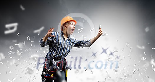 Young emotional woman mechanic screaming in mobile phone