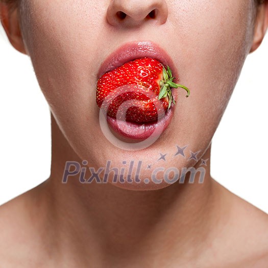 Young woman biting strawberry isolated on white