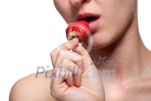 Young woman biting strawberry isolated on white