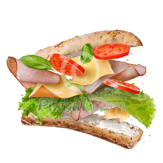 Sandwich with falling ingredients in the air isolated on white - slices of fresh tomatoes, ham, cheese and lettuce