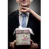 closeup portrait of businessman holding gift with woman hand