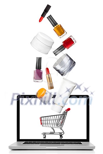 Woman cosmetics falling into notebook isolated on white. Shopping concept