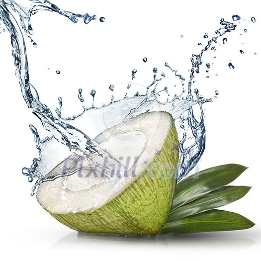 Green coconut with water splash isolated on white