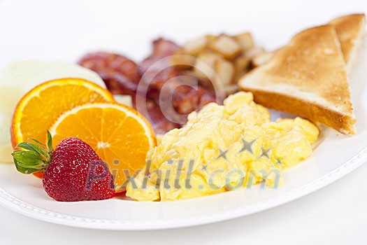 Delicious breakfast of scrambled eggs toast and bacon Delicious breakfast of scrambled eggs toast and bacon