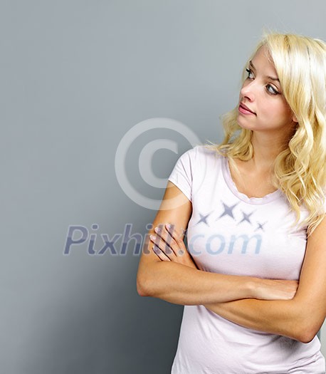 Portrait of young blonde caucasian woman looking to the side and up Portrait of young blonde caucasian woman looking to the side and up