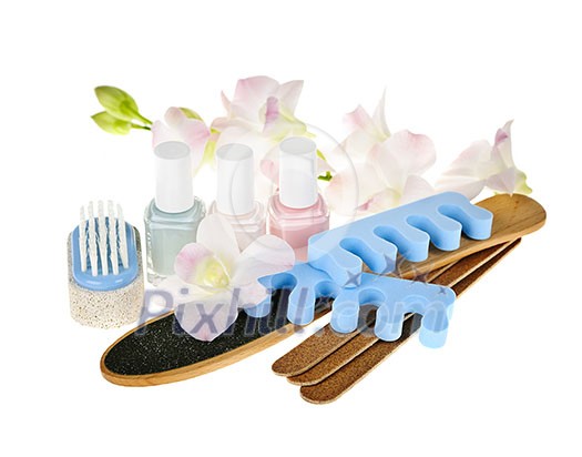 Pedicure accessories and nail polish on white background