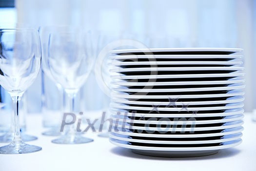 glass goblets and plates on the table glass goblets and plates on the table