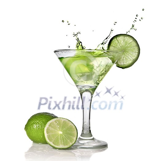 Green alchohol cocktail with splash and green lime isolated on white