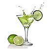 Green alchohol cocktail with splash and green lime isolated on white
