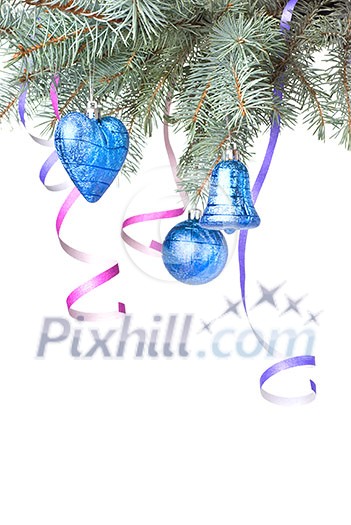 Christmas balls and decoration on fir tree branch isolated on white