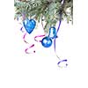 Christmas balls and decoration on fir tree branch isolated on white