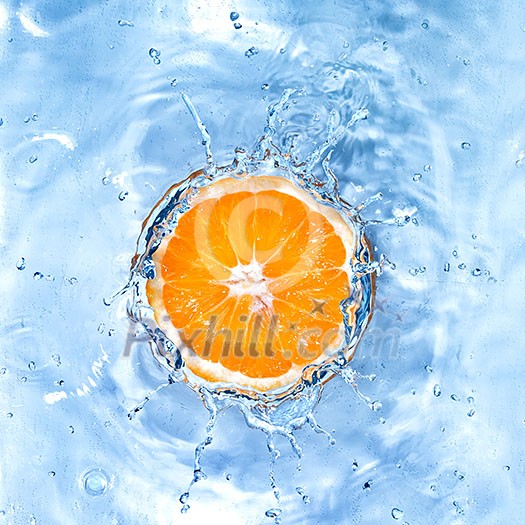 Fresh orange dropped into water with bubbles isolated on white Fresh orange dropped into water with bubbles isolated on white