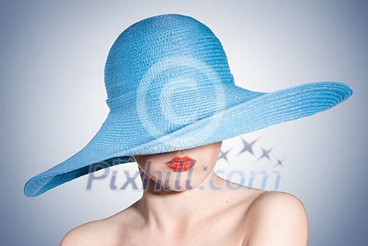 portrait of attractive elegant woman in blue hat