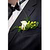 wedding buttonhole with rose on mans suite