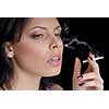 woman smoking on black background
