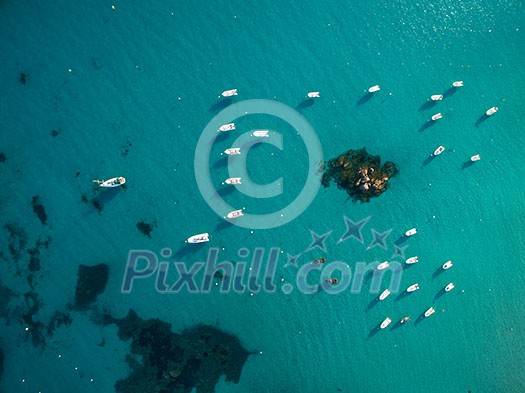 Aerial view of boats in a splendid cove in Corsica