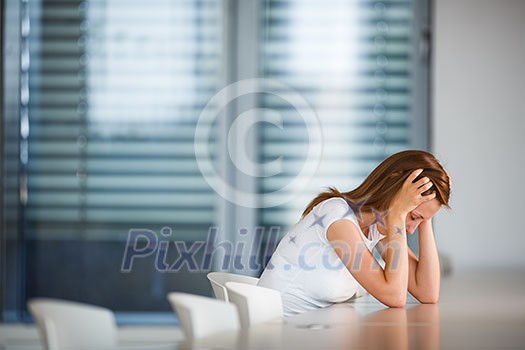 Depressed/anxious young woman (shallow DOF; color toned image)