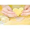 Making heart shaped shortbread cookies with cutters