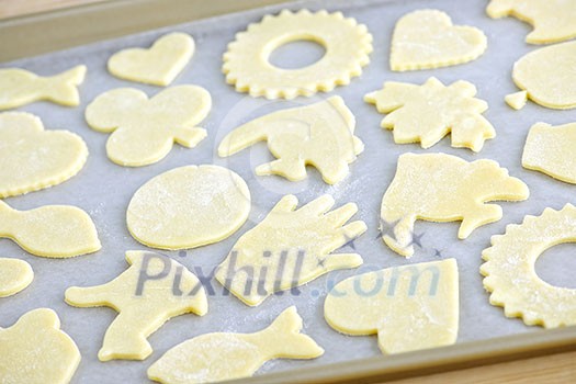 Cookie tray with raw homemade cookies ready for baking Cookie tray with raw homemade cookies ready for baking