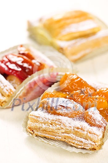 Closeup on slices of flaky fruit strudel desserts Closeup on slices of flaky fruit strudel desserts
