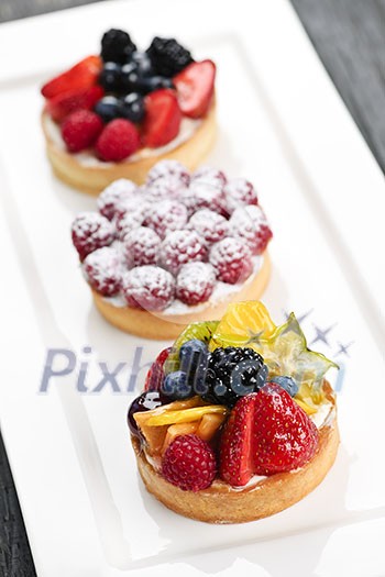 Closeup of fancy gourmet fresh fruit dessert tarts