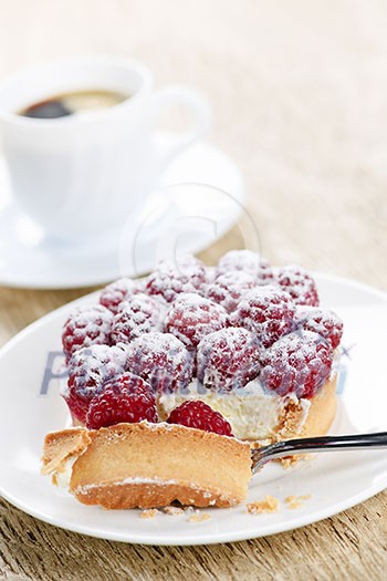 Fresh raspberry tart served with coffee for dessert Fresh raspberry tart served with coffee for dessert
