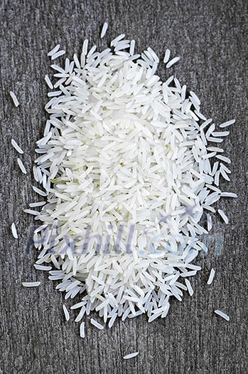 Pile of raw long grain white rice grains Pile of raw long grain white rice grains