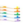 Close up of multicolored toothbrushes on white background