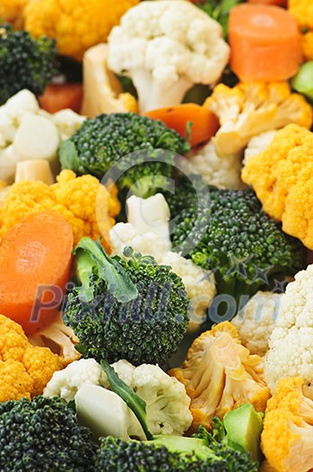 Broccoli cauliflower and carrot vegetable pieces closeup