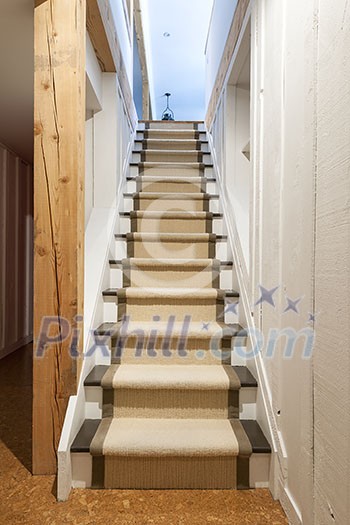 Stairway to basement in home interior with wood paneling Stairway to basement in home interior with wood paneling