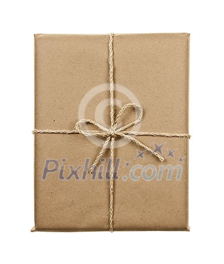 Gift package in brown paper wrapper tied with twine isolated on white background Gift package in brown paper wrapper tied with twine isolated on white background