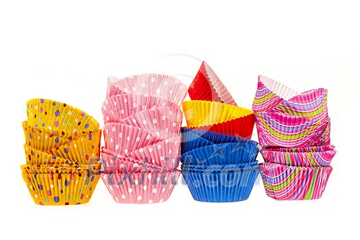 Several stacks of colorful muffin or cupcake cups isolated on white background Several stacks of colorful muffin or cupcake cups isolated on white background