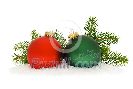 Red and green christmas balls with spruce tree branch isolated on white background Red and green christmas balls with spruce tree branch isolated on white background
